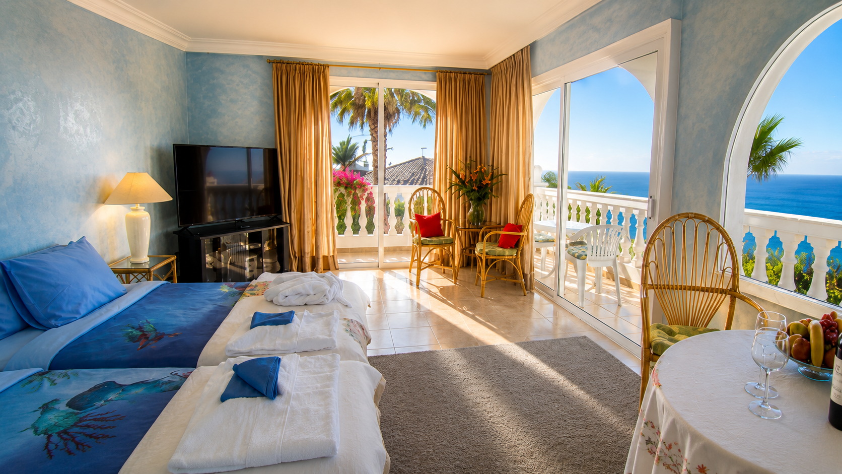 Bright Panorama Studio at Villa Larnia with beds, seating area, balconies and Atlantic views
