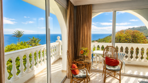 Spacious corner balcony of the Panorama Studio with palms and Atlantic views