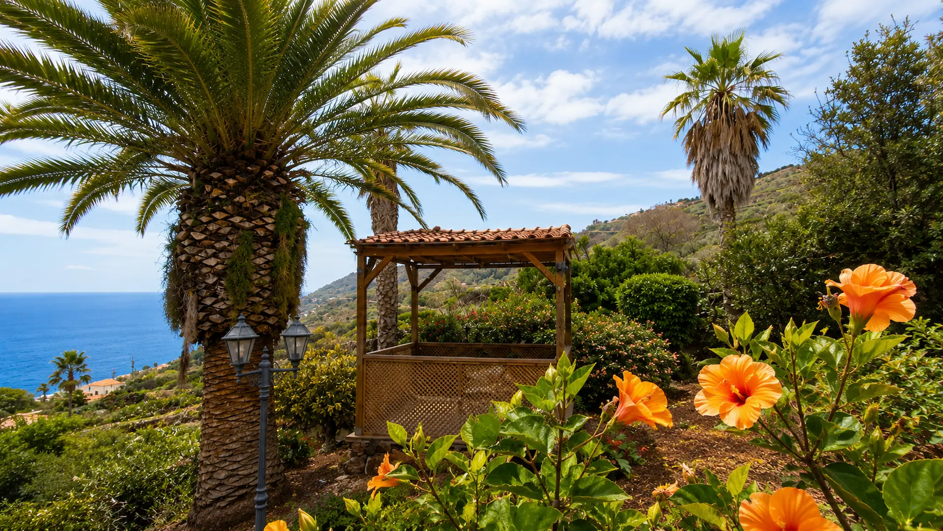 Flowering hibiscus in the palm garden with pavilion